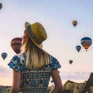 Traveller observing hot air balloons in Turkey
