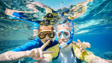 Two Travellers Taking Selfie Underwater with Snorkels On, Great Barrier Reef, Australia