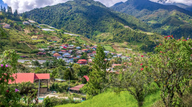 Landscape view of houses in a valley next to a mountain, Kinabalu, Borneo, Malaysia