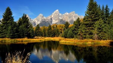 Grand Teton National Park with Mountain range in the background and body of water in the foreground
