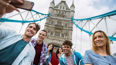 Travelers Taking a Selfie on London Bridge, England