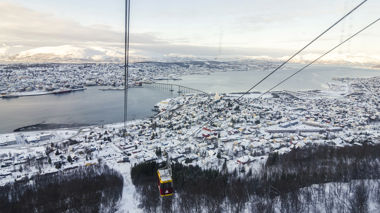 Cable car moves across the landscape of Tromso, in Norway