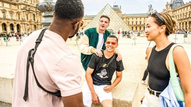 Travellers Outside of the Louvre Museum in Paris, France