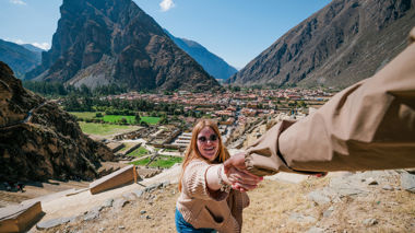 Traveller reaching for arm, Sacred Valley, Peru