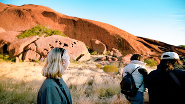 Traveller looking at Uluru, Australia