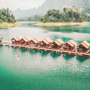 Floating raft houses surrounded by rainforest in Khao Sok National Park - Contiki Southern Thailand to Singapore Tour