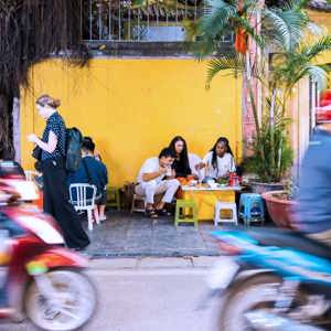Contiki travellers sampling Vietnamese street food in Hoi An - Contiki Hanoi to Siem Reap Tour