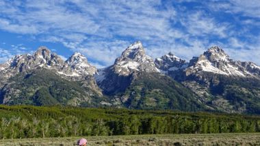 Traveller admiring the mountain range in Grand Tetons National Park