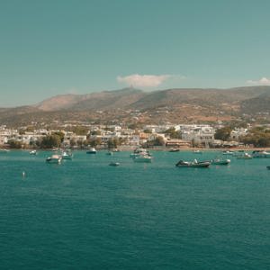Boats anchored off the coast of Paros, Greece - Contiki's Best of Greece with Island Hopping Tour