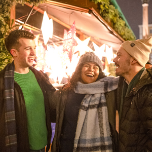 Travellers browsing the German Christmas Market stools, Germany