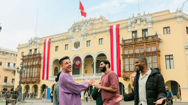 Travellers stood outside of the Municipal Palace in Lima, Peru