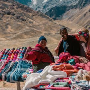 Travellers discovering traditional Andean textiles - Contiki Peru Panorama Tour