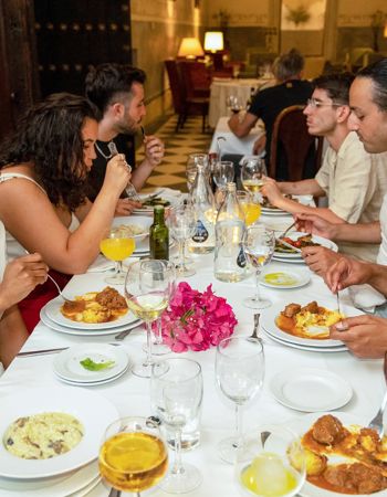 Travelers Enjoying a Dinner at Hotel el Monasterio de San Francisco, Cordoba, Spain