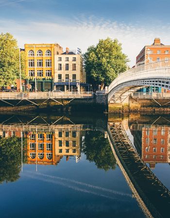 Travellers on Ha'Penny Bridge in Dublin, Ireland