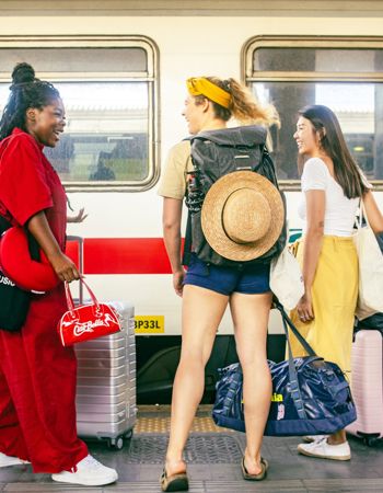 Travellers on the train platform in Rome, Italy