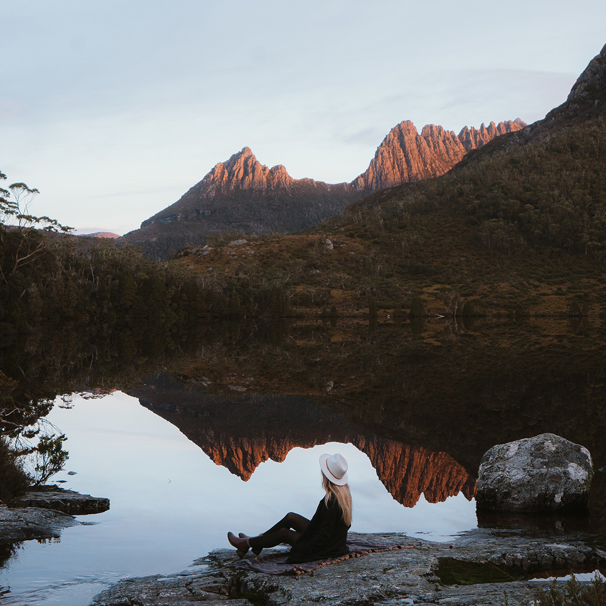 Lady Sitting At Dove Lake In Cradle Mountain Credit Emilie Ristevski