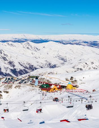 View of Ski Resort and Ski Lift against Mountain Backdrop, Queenstown, New Zealand