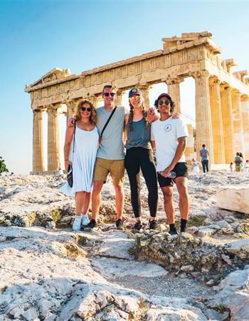 Travellers in front of the Acropolis in Athens, Greece
