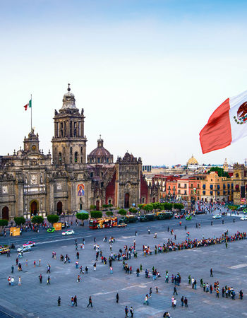 Large Mexican flag waving over Mexico City's historic square, Mexico City, Mexico