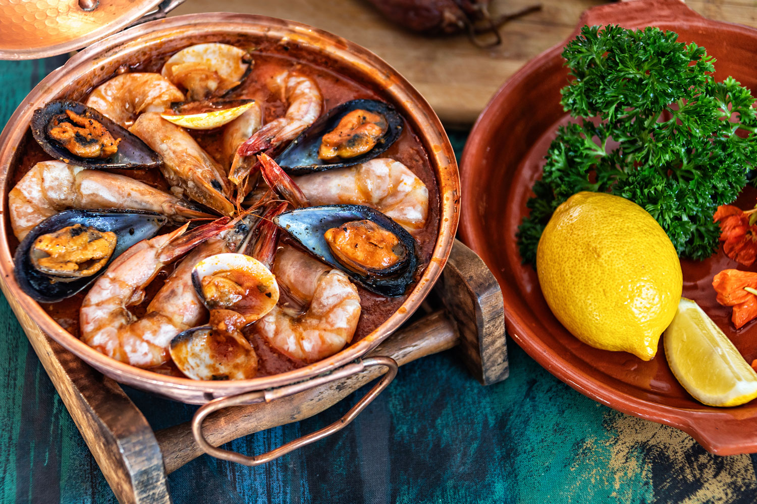 Enjoy an authentic local dinner cooked in a traditional Cataplana and served with Portuguese wines, Algarve, Portugal.