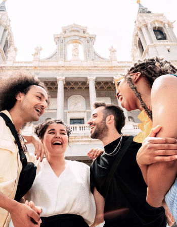 Travelers Laughing and Talking by Almudena Cathedral, Madrid, Spain