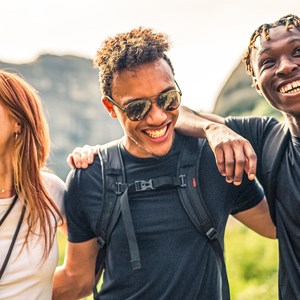 Three travelers laughing and enjoying their time