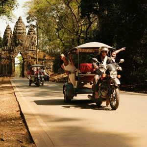 Contiki travellers exploring Angkor Thom by tuk-tuk on Contiki's Ride Cambodia Tour