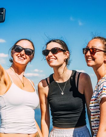 Travellers Taking a Selfie with Lake in Background, Whistler, Canada
