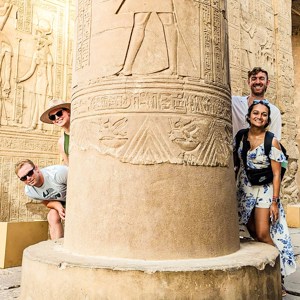 Travellers next to ancient Egyptian architecture, Egypt