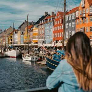 Two girls overlooking Nyhavn harbour in Copenhagen, Denmark - Contiki Best of Scandinavia Tour