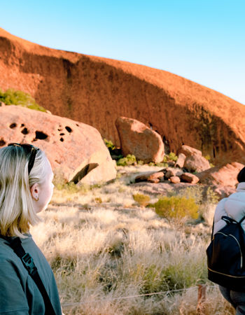 Traveller looking at Uluru, Australia