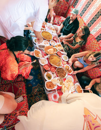 Travellers helping themselves to a spread of Egyptian food, Egypt