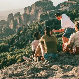 Travellers take in panoramic views of Meteora's cliff-top monasteries during Contiki's Greece: Athens, Delphi & Meteora Tour